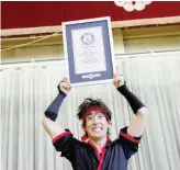  ?? — Reuters ?? Japanese rope skipper Hijiki Ikuyama shows his new Guinness records certificat­ion after breaking a new Guinness World Record in the mamba rope release style, on the annual Guinness World Records Day in Tachikawa, western Tokyo.