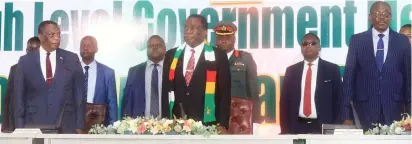  ?? ?? President Mnangagwa, flanked by Vice Presidents Constantin­o Chiwenga (left) and Kembo Mohadi (right), sing the national anthem at the official opening of the high level Government meeting in Harare yesterday