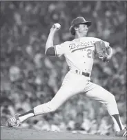  ?? AP file photo ?? Don Sutton of the Los Angeles Dodgers pitches for the National League in the AllStar Game in New York on July 20, 1977.