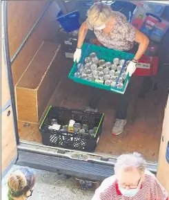  ?? Picture: Peter Taylor-gooby ?? Canterbury Food Bank volunteers unloading donations