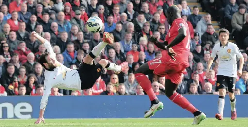  ?? ALEX LIVESEY/GETTY IMAGES ?? SCORING WHEN IT MATTERS: Manchester United’s Juan Mata scores a spectacula­r goal against Liverpool yesterday... it was the United midfielder’s second of the match.