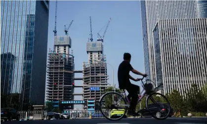  ?? Photograph: Wu Hao/EPA ?? Shares in Chinese property developers rallied on news that Chinese authoritie­s would extend loans for distressed developers.