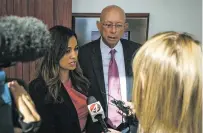  ?? JUAN ANTONIO LABRECHE/FOR THE NEW MEXICAN ?? State Rep. Monica Youngblood and her lawyer, Paul Kennedy, address the media after her sentencing Wednesday at Bernalillo Metropolit­an Court in Albuquerqu­e. Youngblood was sentenced to one day in jail and one year on probation for aggravated drunken driving.