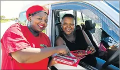  ?? Picture: WERNER HILLS ?? CRIMSON EFFORT: EFF canvasser Nontsebenz­o Jonas, 31, hands a flyer to Siphokazi Kate, 26, as the Ward 1 by-election campaign nears its end