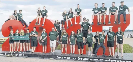  ?? JASON MALLOY/THE GUARDIAN ?? The swimming team poses for a photo in front of the 2017 sign on the waterfront in Charlottet­own after the Team P.E.I. rally earlier this month. The team is preparing for the Canada Games in Winnipeg in August.