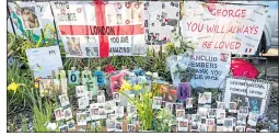  ??  ?? SHRINE: Tributes lined up outside George’s home