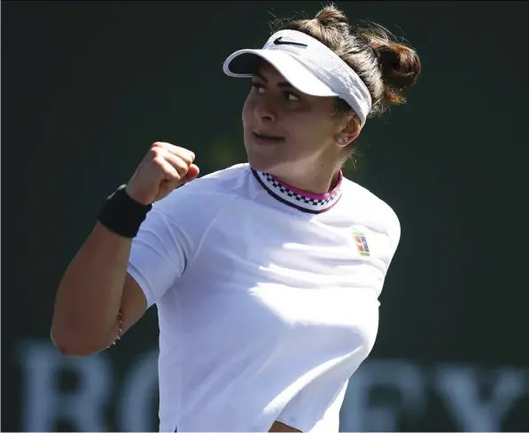  ?? CLIVE BRUNSKILL/GETTY IMAGES ?? Bianca Andreescu pumps her fist Wednesday after defeating Spain’s Garbine Muguruza 6-0, 6-1 in Indian Wells, Calif.