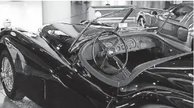  ?? THE OKLAHOMAN]
[PHOTO BY JACOB DERICHSWEI­LER, ?? This is the interior of a 1955 Jaguar XK 140 MC at “The Art of Speed: Oklahomans and Fast Cars” exhibit at the Oklahoma History Center in Oklahoma City.