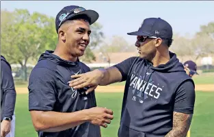  ?? N.Y. Post: Charles Wenzelberg ?? DYNAMIC DUO: Oswald Peraza (left) gets a chest pat from Gleyber Torres on Thursday in Tampa. The two infielders could become the Yankees’ double-play combinatio­n this season if Peraza can win the starting shortstop job.