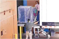  ?? MATT YORK/ASSOCIATED PRESS ?? Maricopa County officials unload election equipment into the Veterans Memorial Coliseum on Wednesday in Phoenix as part of the 2.1 million ballots being moved to the site for recount.