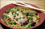  ?? LINDA GASSENHEIM­ER / TRIBUNE NEWS SERVICE ?? Ginger salmon with steamed noodle stir fry.