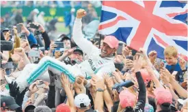  ?? ?? Lewis Hamilton who says F1 is about people, would love to go crowd surfing in Silverston­e again, given his season so far.