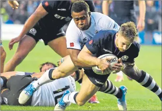  ??  ?? Tommy Seymour goes over for his second try yesterday