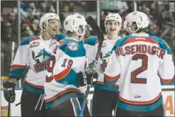  ?? DARREN STONE/Victoria Times Colonist ?? It was all smiles and laughs for the Kelowna Rockets on Friday night, as a group of them celebrate one of three goals by Dillon Dube (19) against the host Royals.