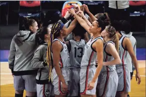  ?? Eric Gay / Associated Press ?? Connecticu­t players huddle before a women’s Final Four NCAA college basketball tournament semifinal game against the Arizona Wildcats on April 2 at the Alamodome in San Antonio, Texas.