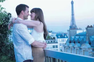  ?? [PHOTO PROVIDED BY DOANE GREGORY, UNIVERSAL PICTURES] ?? ABOVE: Jamie Dornan, left, and Dakota Johnson in “Fifty Shades Freed.” His character considers leaving her because of her pregnancy.