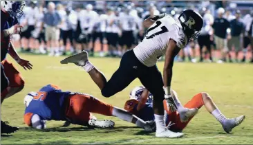  ??  ?? Ridgeland running back Jalyn Shelton leaves a pair of Northwest defenders in his wake as he plows in for a score during a 48-7 Panther victory in Tunnel Hill. (Photo by Matt Hamilton/Dalton Daily Citizen-News)