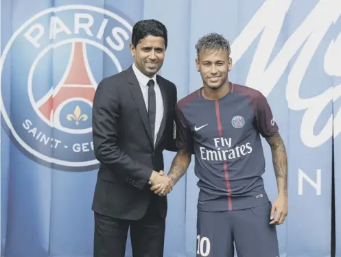  ??  ?? 0 Paris Saint-germain president Nasser Al-khelaifi unveils Neymar after his world record £198million transfer from Barcelona.