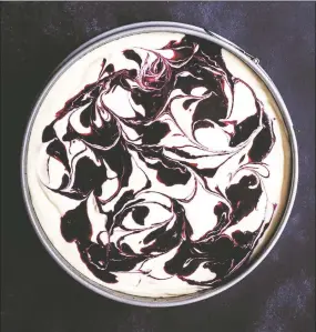  ?? Sally Pasley Vargas / Down East Books ?? Dorie’s Cheesecake with Blueberry Swirls — One bite and you will start swooning over its sumptuous, creamy texture.