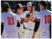  ??  ?? Elizabeth Conley / Houston Chronicle Sam Houston State starter Hayden Wesneski, center, is congratula­ted as he leaves the field in the fourth inning Thursday at Constellat­ion Field in Sugar Land.