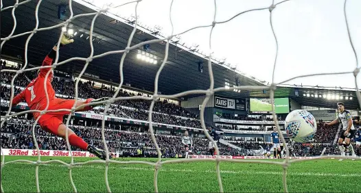  ?? REX ?? Three to the good: Derby’s Chris Martin slots the ball past keeper Christian Walton from the spot to seal victory