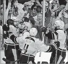  ?? [MARK HUMPHREY/THE ASSOCIATED PRESS] ?? Right wing James Neal, left, celebrates with teammates after scoring late in the second period to give the Predators a 3-1 lead.