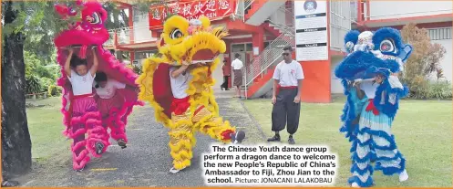  ?? Picture: JONACANI LALAKOBAU ?? The Chinese Youth dance group perform a dragon dance to welcome the new People’s Republic of China’s Ambassador to Fiji, Zhou Jian to the school.