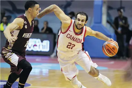  ?? — GETTY IMAGES ?? Canada’s Phil Scrubb drives past Venezuela’s Heissler Guillent during a qualifier for the 2019 FIBA World Cup. Canada lost 84-76 but still clinched a berth in the World Cup.