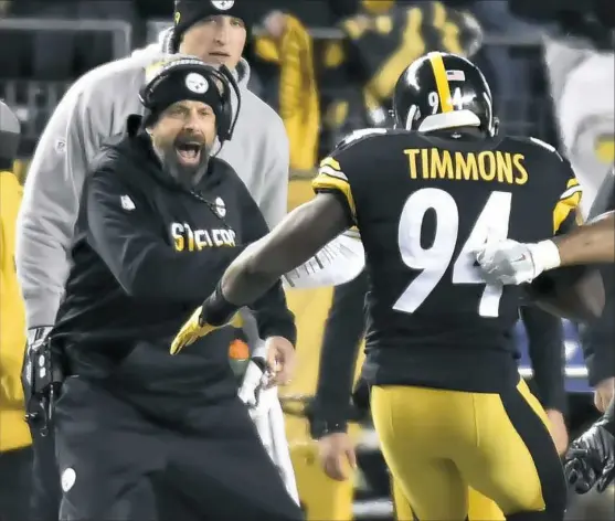  ?? Matt Freed/Post-Gazette ?? Offensive coordinato­r Todd Haley celebrates after linebacker Lawrence Timmons intercepte­d a pass in the second quarter against the New York Giants Sunday at Heinz Field.