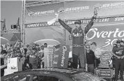  ?? [AP PHOTO] ?? Driver Denny Hamlin celebrates Sunday after winning the NASCAR Cup Series 301 at New Hampshire Motor Speedway in Loudon, N.H.