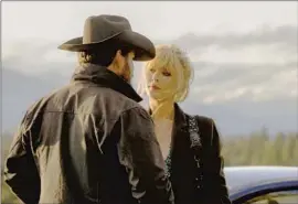  ?? Paramount Network ?? “THE WRITING of these two characters together is beautiful,” Kelly Reilly says of her character Beth and her husband, Rip (Cole Hauser), in “Yellowston­e.”