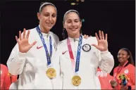  ?? Toni L. Sandys / The Washington Post ?? Team USA guards Diana Taurasi, left, and Sue Bird celebrate their fifth gold medals after defeating Japan at the Tokyo Olympics on Aug. 8.