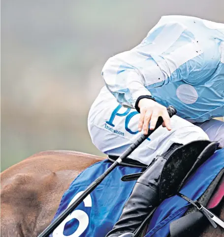  ??  ?? Finishing kick: Rachael Blackmore puts in maximum effort to encourage Honeysuckl­e to victory at Cheltenham