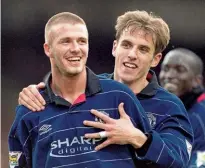  ??  ?? Reunion…Beckham and Neville came through the Manchester United academy together