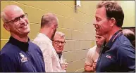  ?? Mike Anthony / Hearst Connecticu­t Media ?? UConn football coach Jim Mora, right, chats with men’s basketball coach Dan Hurley, left, before the UConn Coaches Road Show event Monday in Southingto­n. Women’s basketball coach Geno Auriemma is in the background.