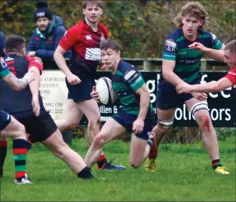  ?? ?? Clogher Valley full back Ewan Haire sidesteps his way through the Limavady defenders.