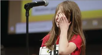  ?? PAUL CONNORS — BOSTON HERALD ?? Manning Elementary’s Nate Derr reacts after realizing he misspelled a word, eliminatin­g him from competitio­n during the BCYF Citywide Spelling Bee.