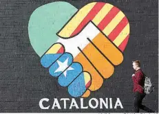  ?? Niall Carson /PA Wire/PA via AP ?? A new pro-Catalan independen­ce mural is seen Wednesday on Falls Road in Belfast, Northern Ireland.