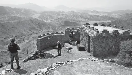  ?? ANJUM NAVEED/AP ?? Pakistani army soldiers maintain a hilltop observatio­n post in August in the Khyber Pakhtunkhw­a province along the border with Afghanista­n .