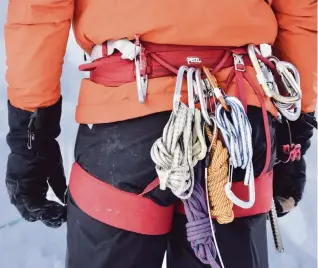  ?? MARK JOHANSON Chicago Tribune ?? Larry Shiu, a teacher with Yamnuska Mountain Adventures, keeps extra ropes and carabiners on his harness.