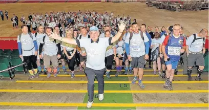  ??  ?? Sir Gareth Edwards leads the big walk in aid of prostate cancer