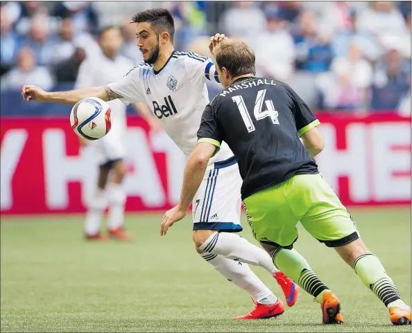  ?? GERRY KAHRMANN/PNG ?? Pictured evading Seattle’s Chad Marshall on Saturday, Whitecaps midfielder Pedro Morales has shown little of the magic which dazzled fans last season, and it’s beginning to show in the team’s performanc­es.