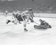  ?? AP FILE PHOTO ?? GOAT ON ICE: Boston Bruins great Bobby Orr glides past Los Angeles Kings goalie Rogie Vachon in a 1972 game at the Boston Garden.