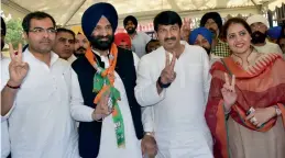  ?? — PTI ?? Delhi BJP president Manoj Tiwari with party MP Parvesh Verma and SAD-BJP candidate for Rajouri Garden Assembly bypoll M.S. Sirsa during the filing of nomination papers in Delhi on Tuesday.