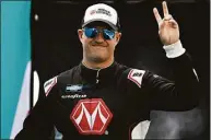  ?? Sean Gardner / Getty Images ?? Ryan Preece, driver of the No. 17 Compustar/RaceChoice Ford, waves to fans as he walks onstage during driver intros prior to the NASCAR Camping World Truck Series Baptist Health 200 at Homestead-Miami Speedway on Oct. 22 in Homestead, Fla.