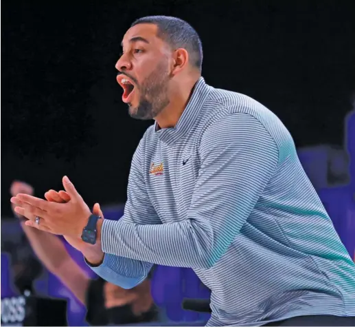  ?? TIM AYLEN/AP ?? Drew Valentine, who became head coach after Porter Moser’s exit, cheers Loyola on against Arizona State during the Battle 4 Atlantis tournament in the Bahamas.