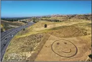  ?? (AP/The Orange County Register/Dean Musgrove) ?? Happy Face Hill is shown Friday in Simi Valley, Calif. The area has seen greener days, as rainfall totals are down for the past several months.