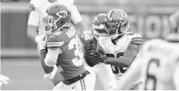  ?? JEFF ROBERSON/AP ?? Chiefs’ Tyrann Mathieu intercepts a pass against the Browns on Jan. 17.