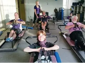  ??  ?? Left: An Intermedia­te class on the Reformer Beds - all dressed in purple. Why? Recently we ran a week raising money for Relay for Life where each class dressed in purple and gave a gold coin donation. We raised $747.50 in that week. A caring community!