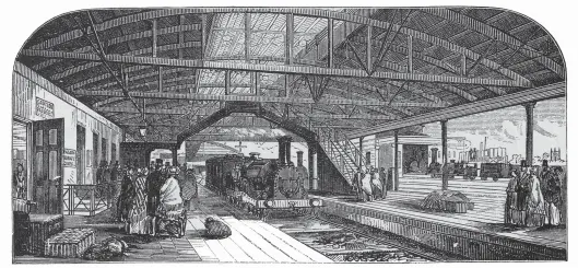  ??  ?? A London-bound train arrives at Reading’s single-track and one-sided station, circa 1850 – the first excursion from Oxford to London stopped here. The everyday scene depicted is perhaps quite unlike that when the double-headed 58 vehicle train transporti­ng 3,132 passengers from Oxford, Abingdon Road, and Didcot was delayed for 30 minutes here while an up express passed. Opened in March 1840 as a terminus pending further westbound extensions towards Bristol, the facilities at Reading, like so many of the first stations, were soon totally inadequate for the needs and popularity of a growing railway.